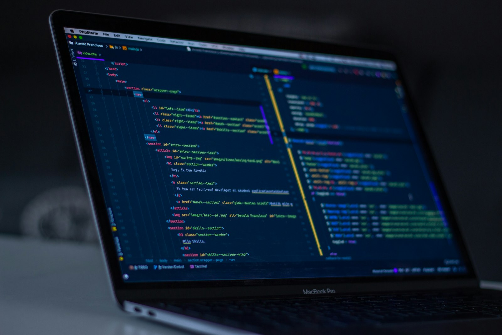 Illustration of developers working at a computer screen with code